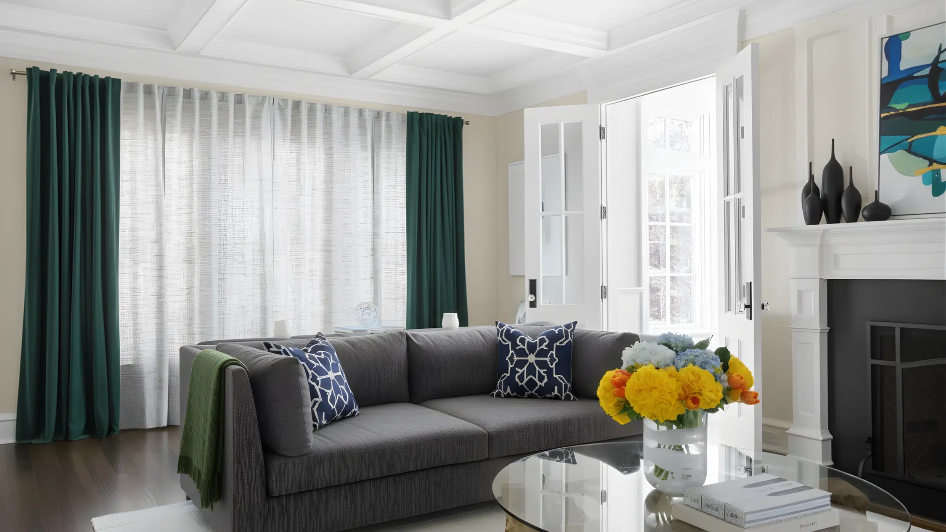 Floor length living room curtains framing large windows with sofa seating