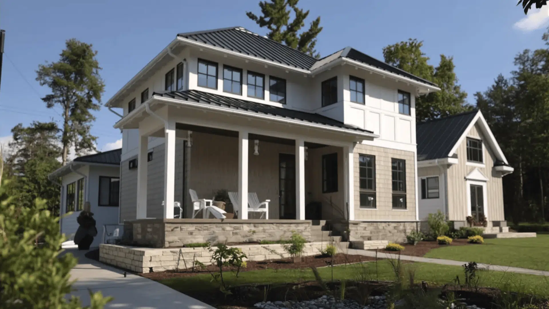 A residence with an expansive front porch and a generous yard area