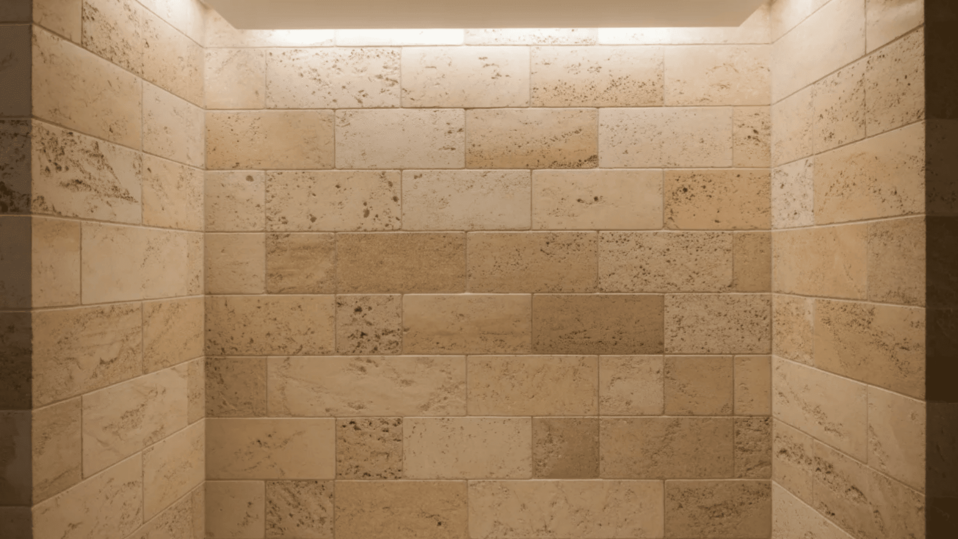 A shower with a light fixture above, illuminating the space for a bright and bathing experience