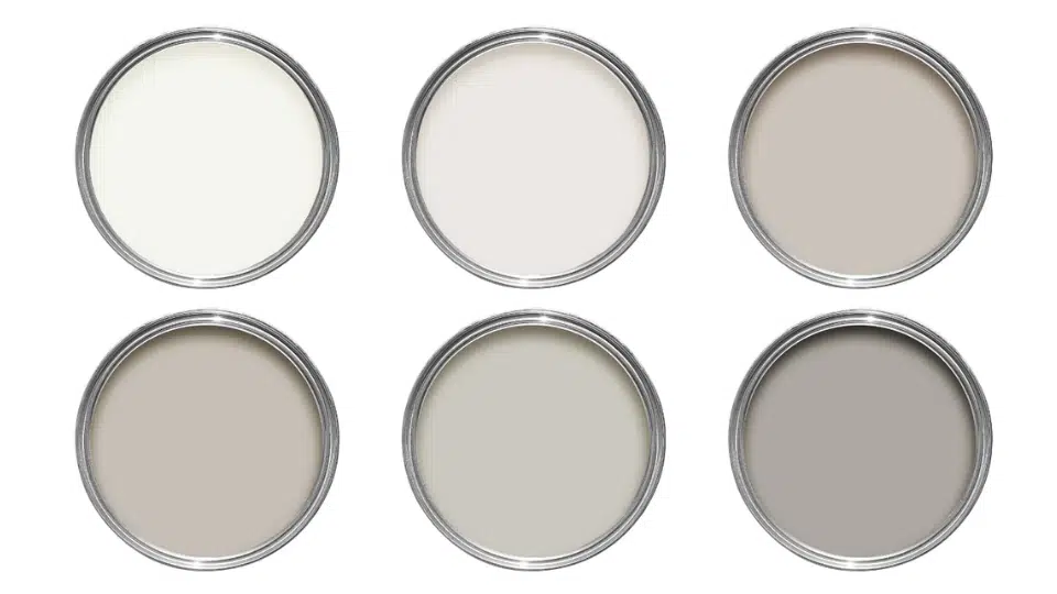 Six Sherwin Williams greige paint colors in round swatches, showing a range of warm and cool tones