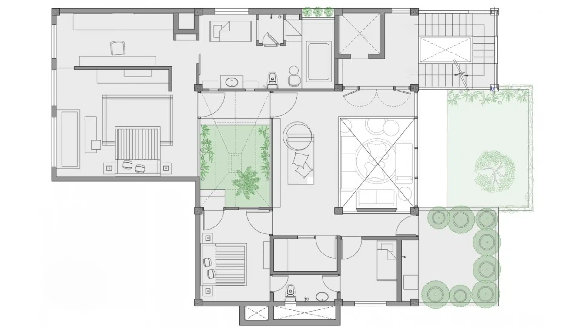 Floor plan drawing showing internal spaces, staircases, a courtyard, and exterior garden areas