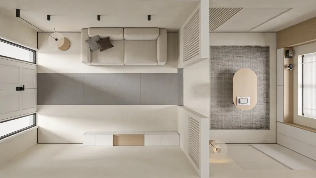 Overhead view of a minimalist modern living room featuring a light beige sofa, oval coffee table, recessed lighting, and a white paneled wall with windows