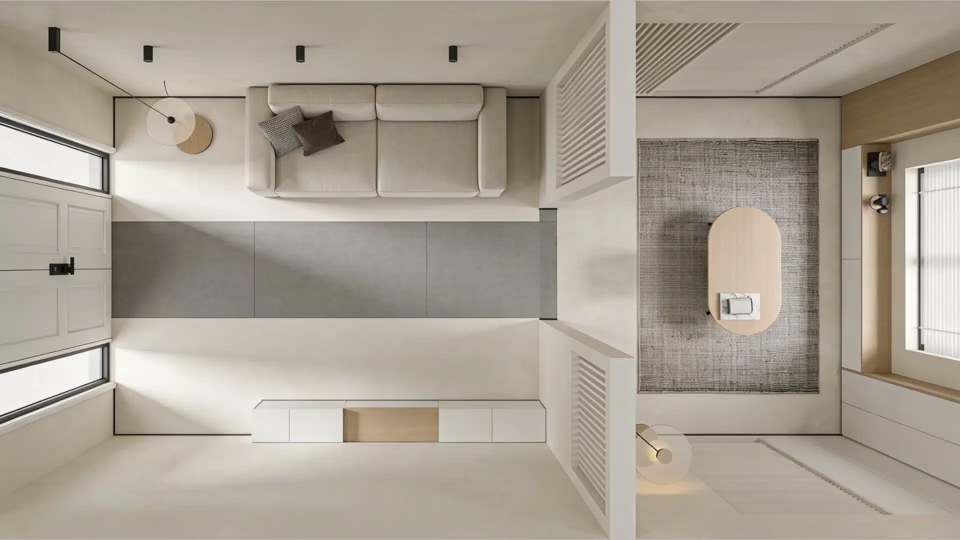 Overhead view of a minimalist modern living room featuring a light beige sofa, oval coffee table, recessed lighting, and a white paneled wall with windows