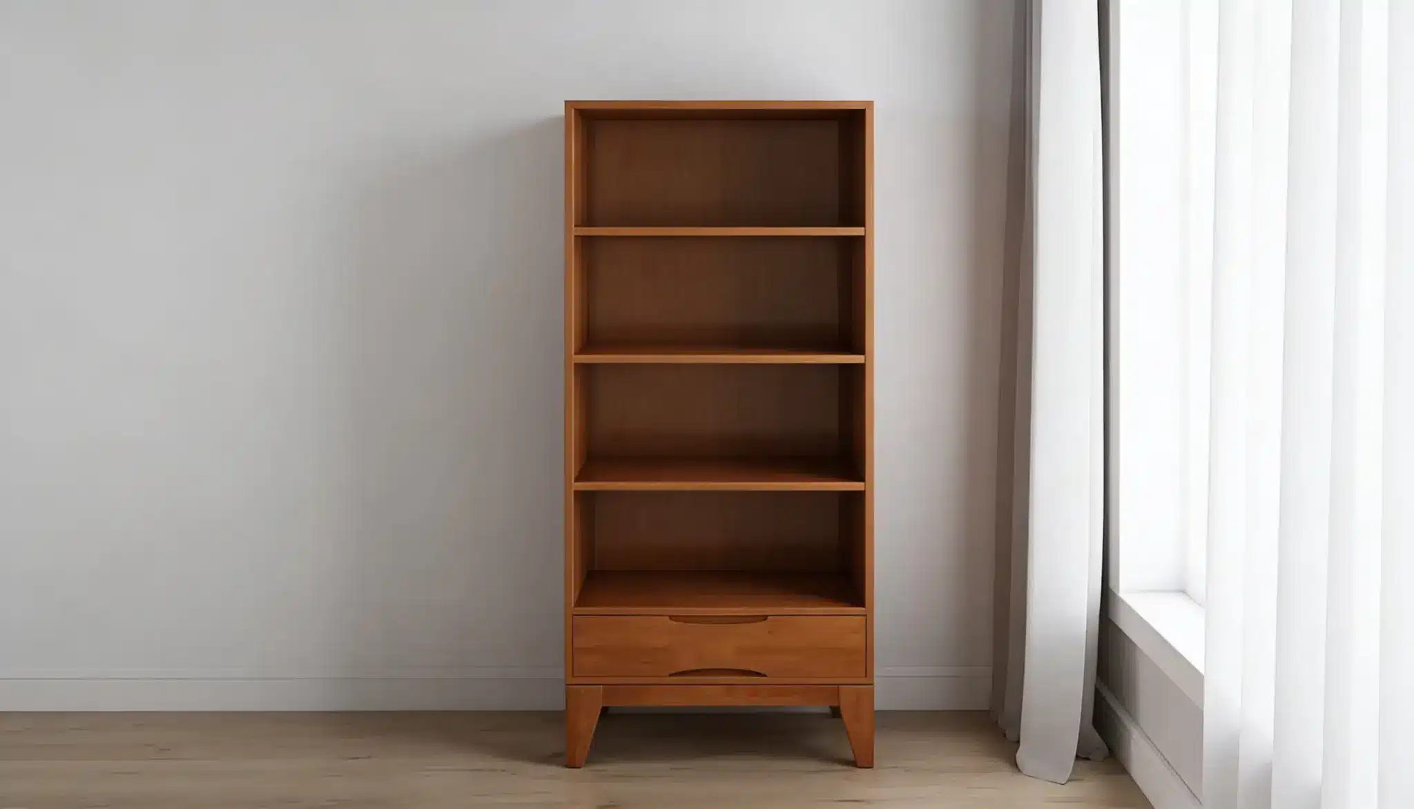 A tall, narrow, mid-century modern wooden bookshelf with four shelves and a single drawer sits next to a window with sheer white curtains.