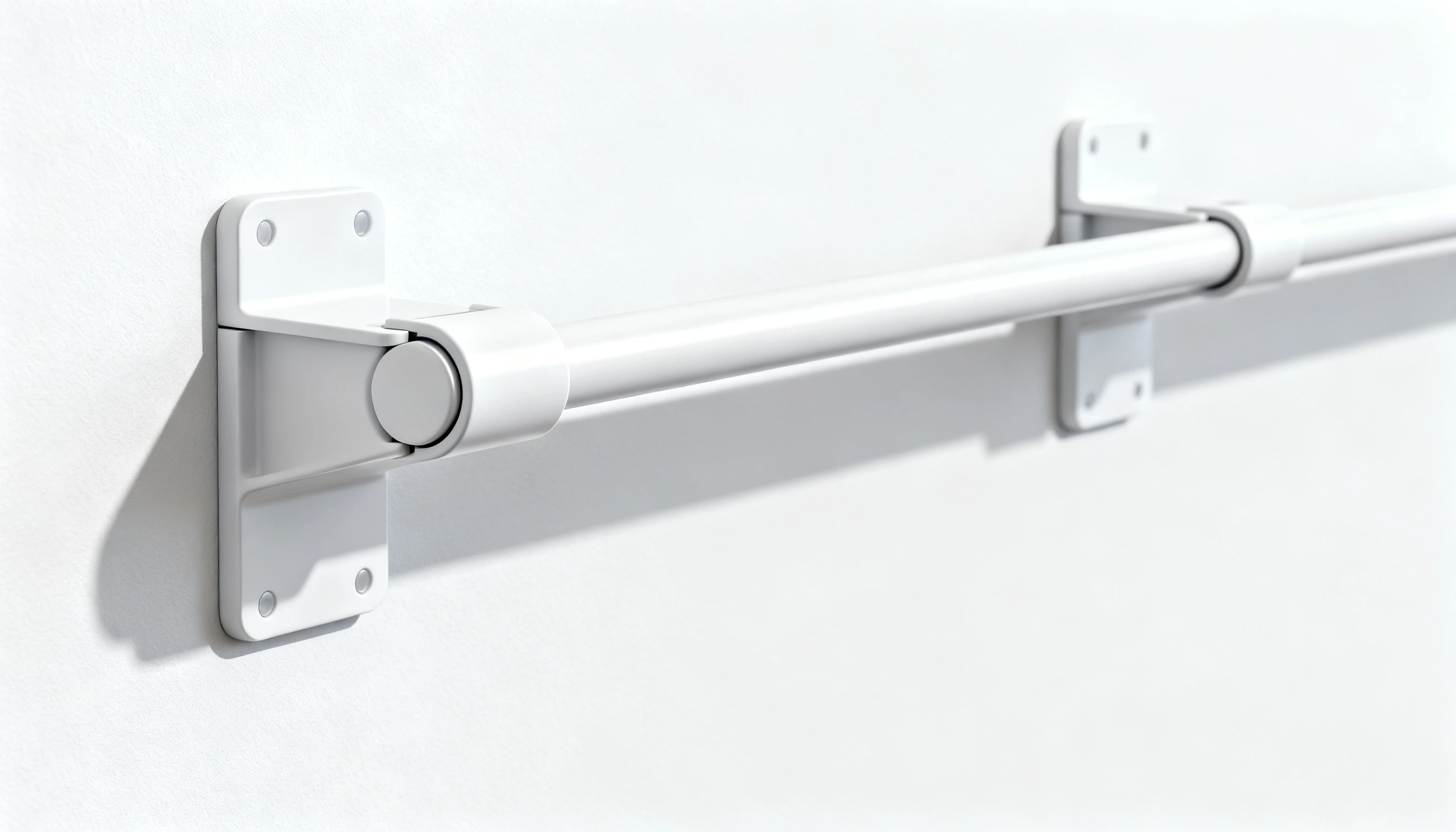 White metal grab bar with two mounting brackets against a white wall.
