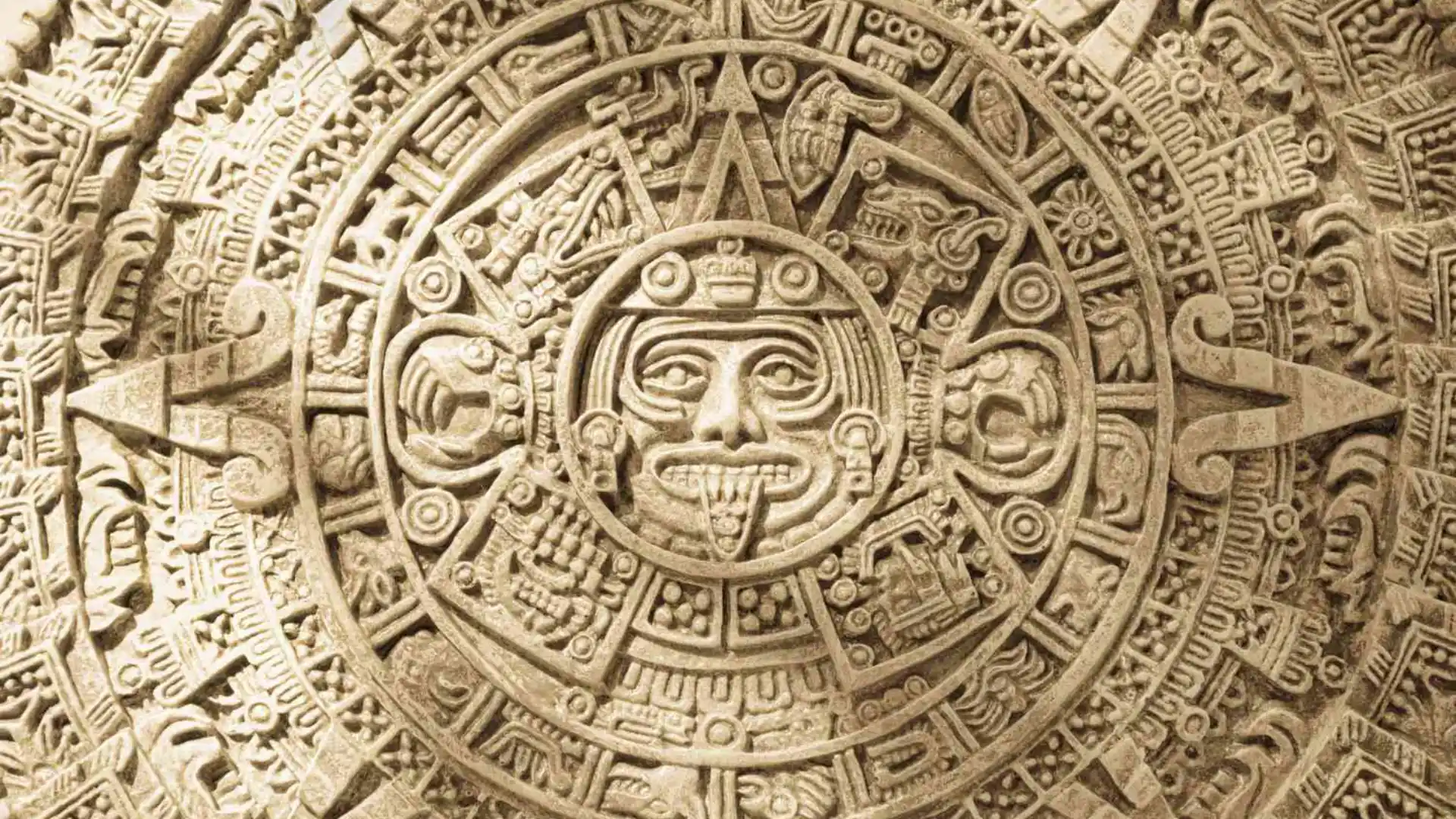 Aztec calendar stone with intricate carvings and symbolic figures
